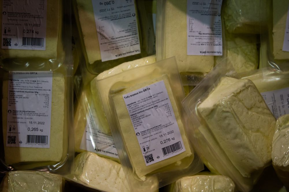 Packs of local organic tofu discarded before their use-by date